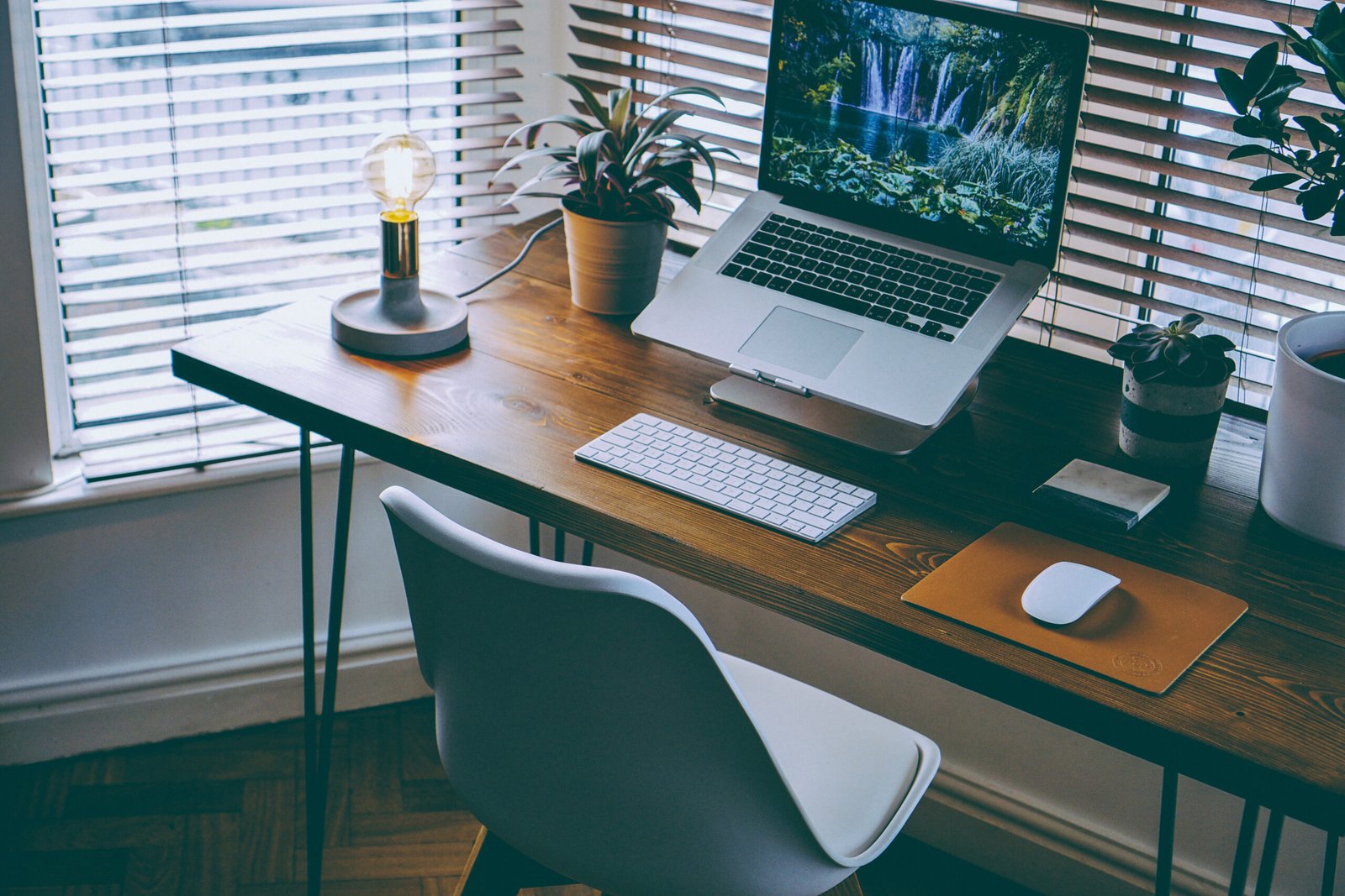 Organized desk with laptop in a home office